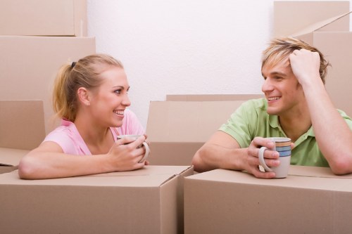 Professional movers handling furniture and boxes during a Crystal Palace home move