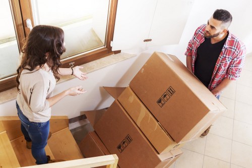 Loading furniture and boxes into a removal truck in south London