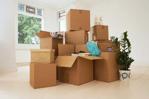Removal team working with boxes in a Crystal Palace home