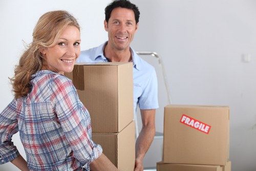 Professional movers navigating stairs and access in a Crystal Palace property